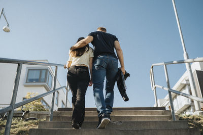 Father and daughter embracing on way home