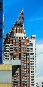 Low angle view of modern building against sky