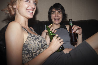 Cheerful friends drinking beer