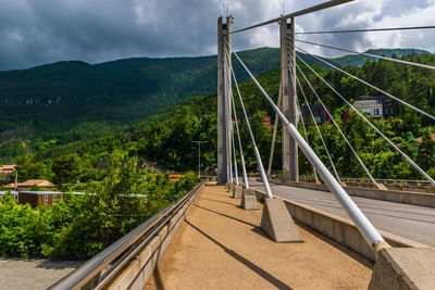 View of bridge against cloudy sky