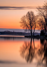 Scenic view of lake against sky during sunset