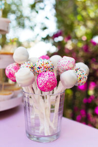 Close-up of cake pops in glass on table