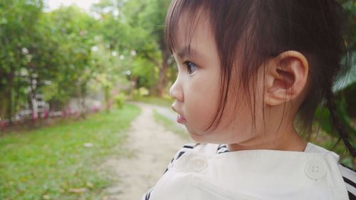 Portrait of cute girl looking away