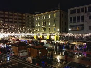 Buildings in city at night
