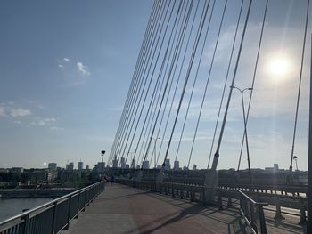 Low angle view of bridge against buildings in city