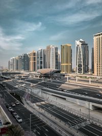 High angle view of modern buildings in city against sky