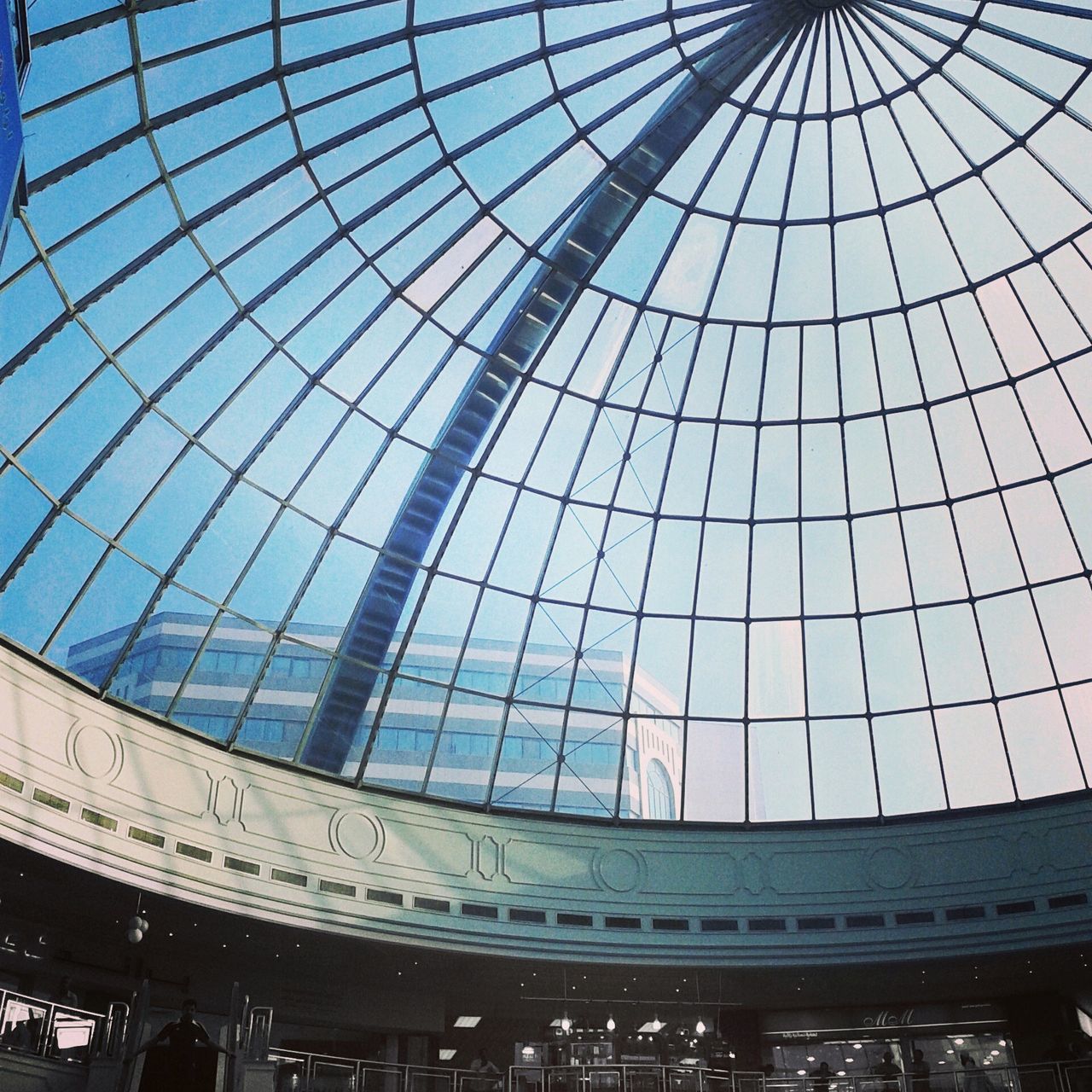 indoors, architecture, built structure, glass - material, low angle view, famous place, ceiling, architectural feature, pattern, transparent, international landmark, modern, travel destinations, capital cities, skylight, tourism, travel, design, dome, window