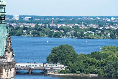 Scenic view of sea against buildings in city