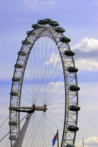 Low angle view of ferris wheel against sky