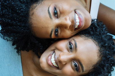 Close up two african woman next to each other portrait