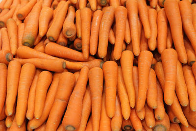 Pile of carrots in supermarket. full frame shot of carrots for sale at market