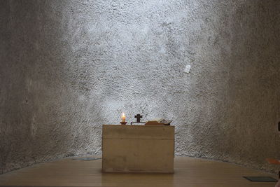 Men sitting on table against wall