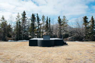 Built structure against trees against sky