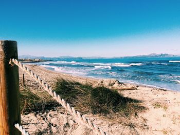 Scenic view of calm sea against blue sky