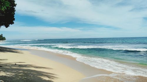 Scenic view of beach against sky