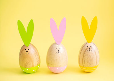 Close-up of easter eggs on yellow background