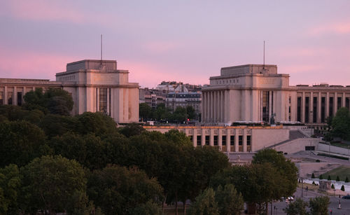 Buildings in city at sunset