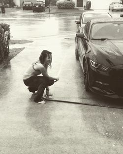 Woman sitting on the road