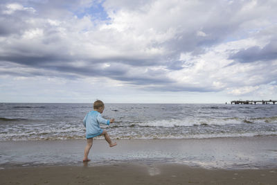 Full length of boy on beach