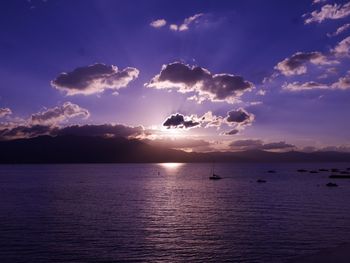 Scenic view of boats on lake tahoe at sunset