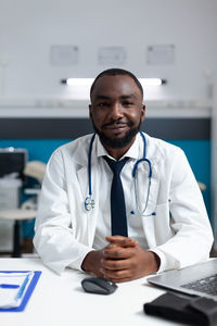 Portrait of businessman working at clinic