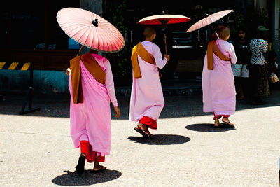 Full length of woman in umbrella