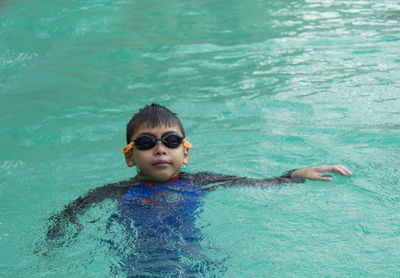 Boy swimming in pool