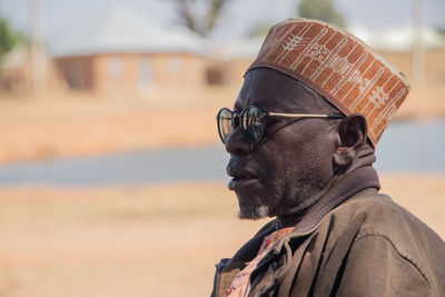 A farmers watching vaccination campaign event in his community