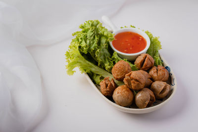 High angle view of fruits in plate on table