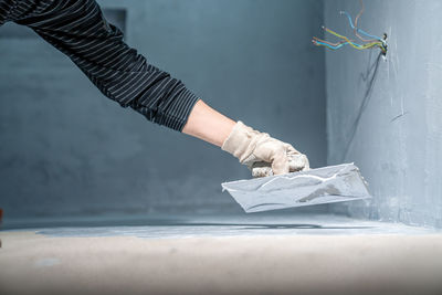 Cropped hand of person cleaning equipment