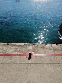 High angle view of railing by sea