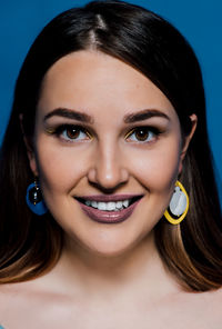 Close-up portrait of a smiling young woman