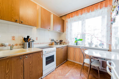 Interior room apartment. standard repair decoration in hostel. kitchen, dining area