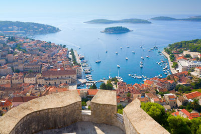 High angle view of townscape by sea