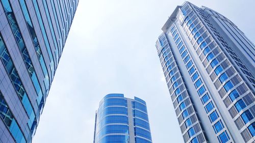 Low angle view of modern buildings against sky