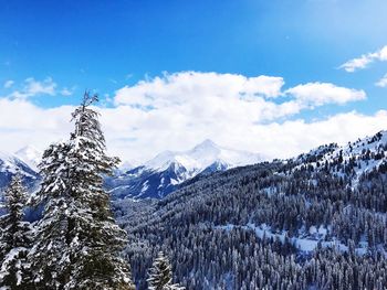 Scenic view of snowcapped mountains against sky