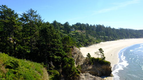 Scenic view of waterfall against sky