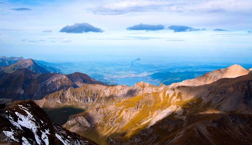 Scenic view of snowcapped mountains against sky