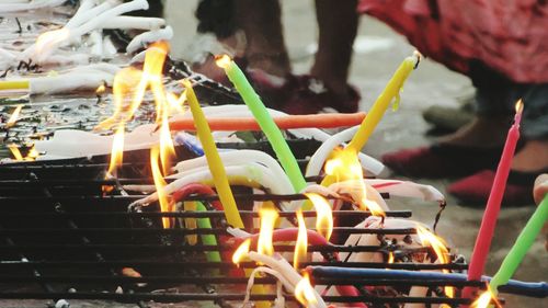 Close-up of fire on barbecue at night