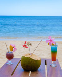 Close-up of drink on beach