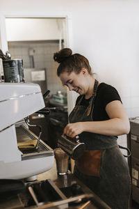 Woman working with coffee at home