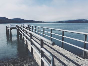 Pier over sea against sky