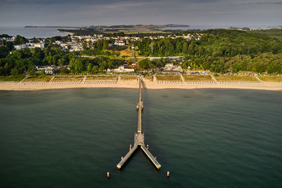 High angle view of trees by sea against sky