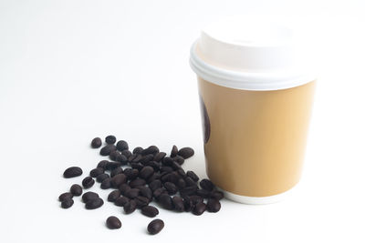 Close-up of coffee beans against white background