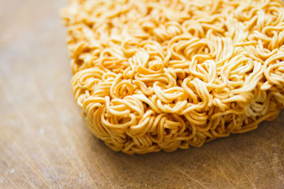 Close-up of raw noodles on table