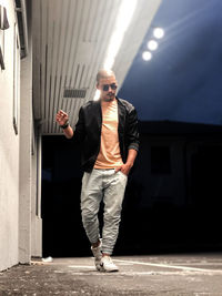 Young man wearing sunglasses standing outdoors