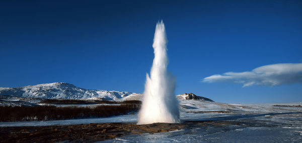 Strokkur geysir in south iceland erupting at winter time