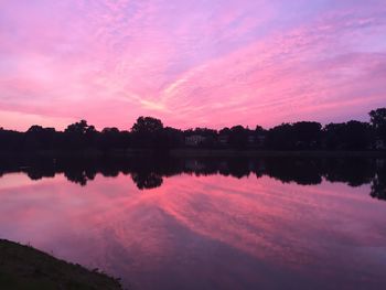 Scenic view of calm lake at sunset