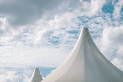 Tent against cloudy sky