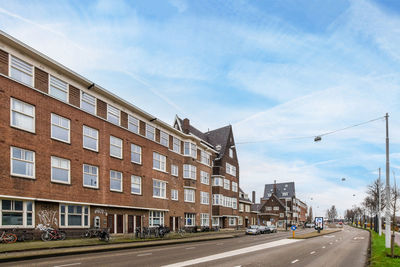 Buildings in city against sky